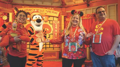 Visitors pose for photos with Tigger during the Lunar New Year celebrations at Disneyland